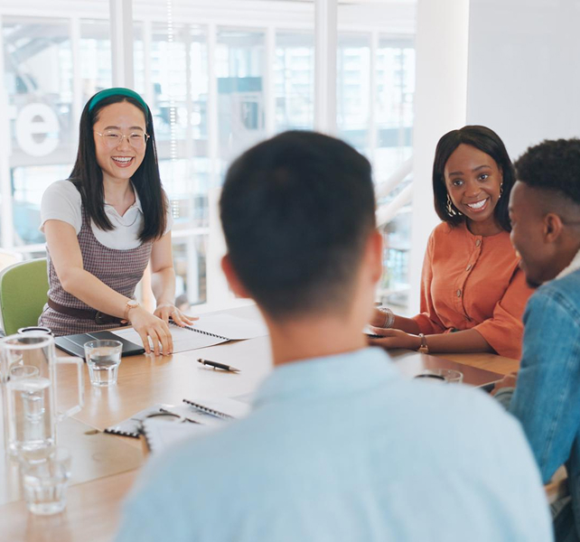 a group of friends sitting on the table and talking