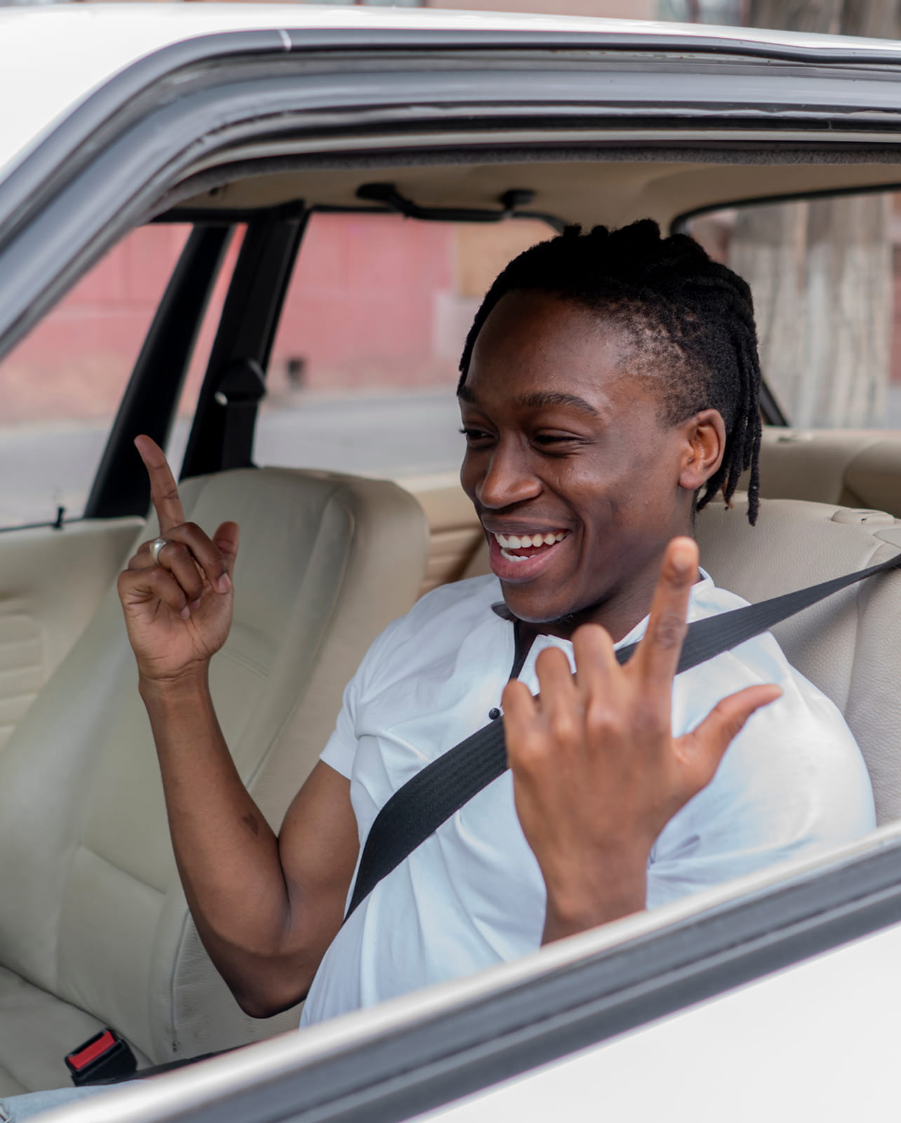 happy man sitting in a car